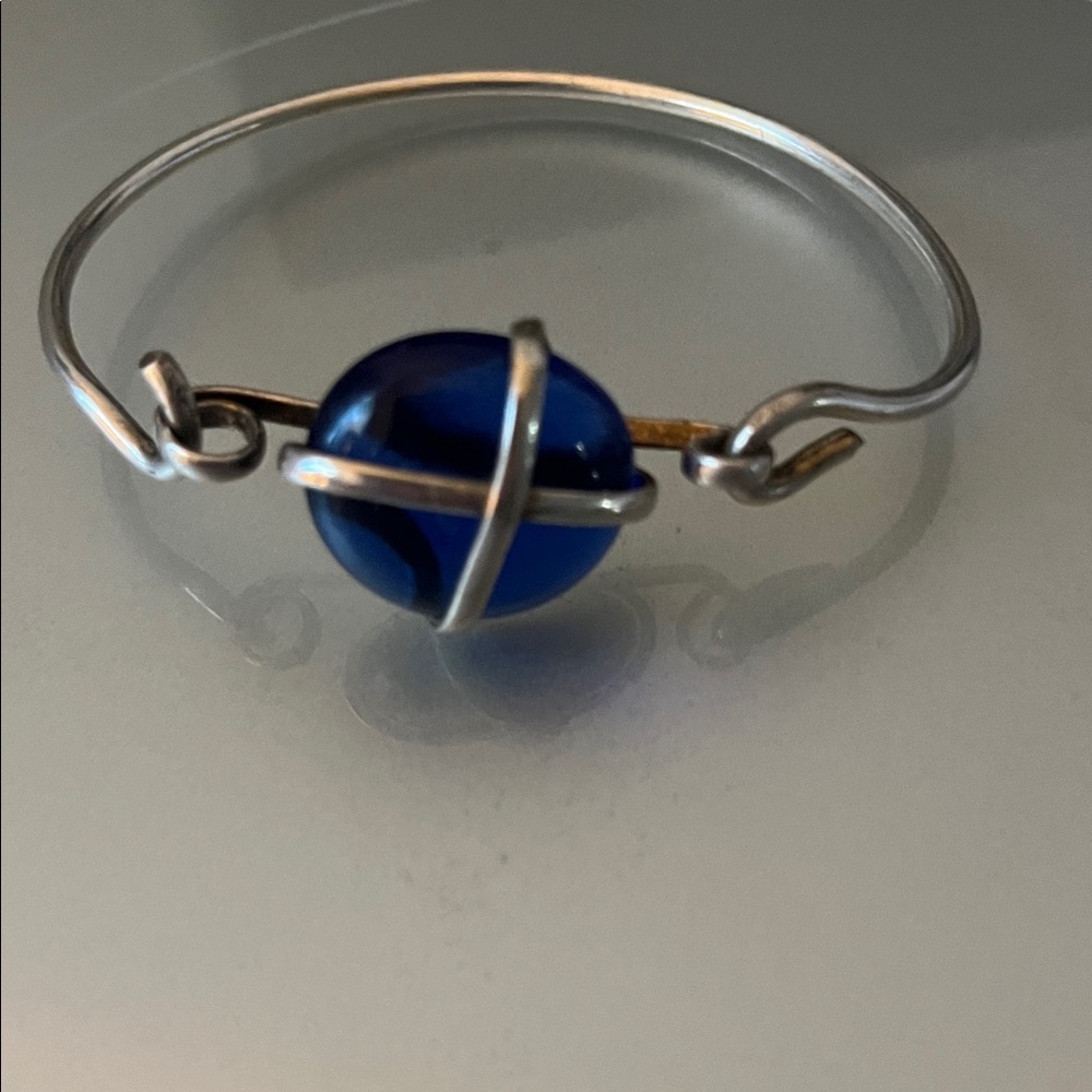Sleek Silver Bracelet with Deep Blue Accent